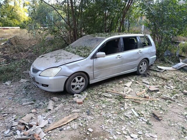 Сірий Міцубісі Lancer, об'ємом двигуна 1.6 л та пробігом 252 тис. км за 1999 $, фото 1 на Automoto.ua