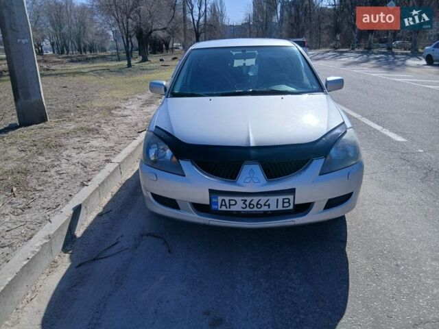 Серый Мицубиси Лансер, объемом двигателя 1.6 л и пробегом 291 тыс. км за 3700 $, фото 1 на Automoto.ua