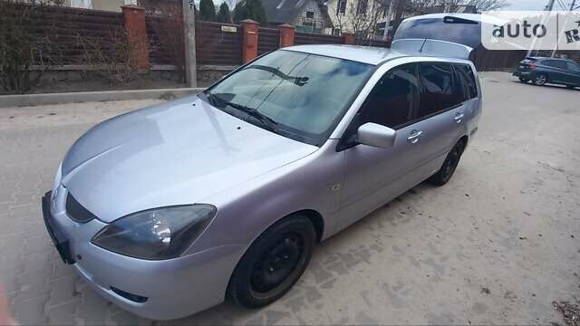 Серый Мицубиси Лансер, объемом двигателя 2 л и пробегом 345 тыс. км за 3500 $, фото 1 на Automoto.ua