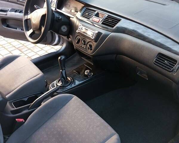 Серый Мицубиси Лансер, объемом двигателя 1.6 л и пробегом 248 тыс. км за 4000 $, фото 1 на Automoto.ua