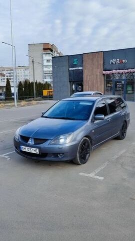 Серый Мицубиси Лансер, объемом двигателя 1.58 л и пробегом 306 тыс. км за 4300 $, фото 1 на Automoto.ua