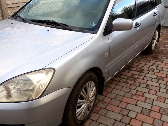 Сірий Міцубісі Lancer, об'ємом двигуна 16 л та пробігом 248 тис. км за 4000 $, фото 1 на Automoto.ua