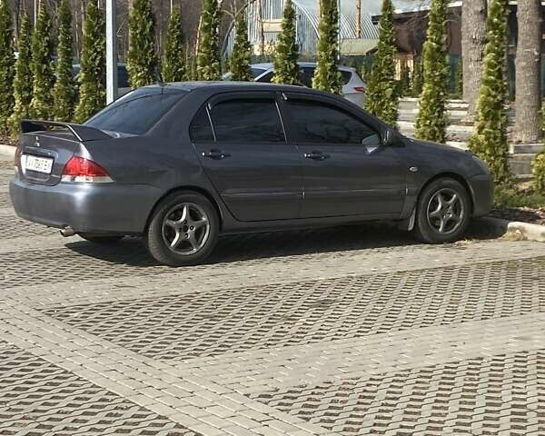 Сірий Міцубісі Lancer, об'ємом двигуна 1.6 л та пробігом 280 тис. км за 4200 $, фото 1 на Automoto.ua
