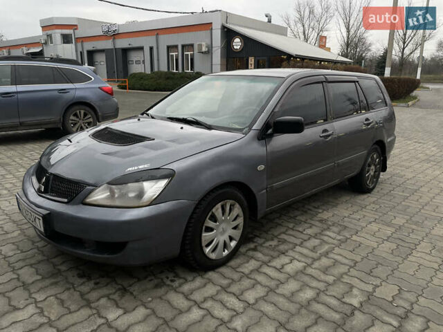 Серый Мицубиси Лансер, объемом двигателя 1.6 л и пробегом 667 тыс. км за 2999 $, фото 1 на Automoto.ua