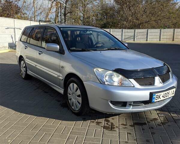 Сірий Міцубісі Lancer, об'ємом двигуна 1.58 л та пробігом 220 тис. км за 4499 $, фото 1 на Automoto.ua