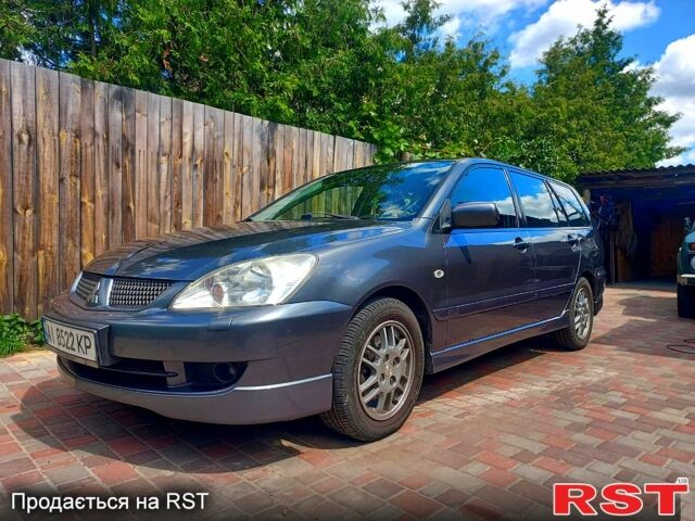 Серый Мицубиси Лансер, объемом двигателя 1.6 л и пробегом 279 тыс. км за 5600 $, фото 1 на Automoto.ua