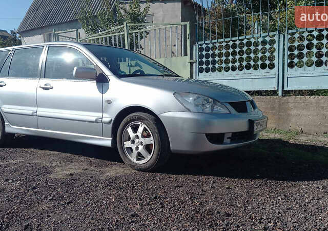 Серый Мицубиси Лансер, объемом двигателя 1.58 л и пробегом 296 тыс. км за 3850 $, фото 1 на Automoto.ua