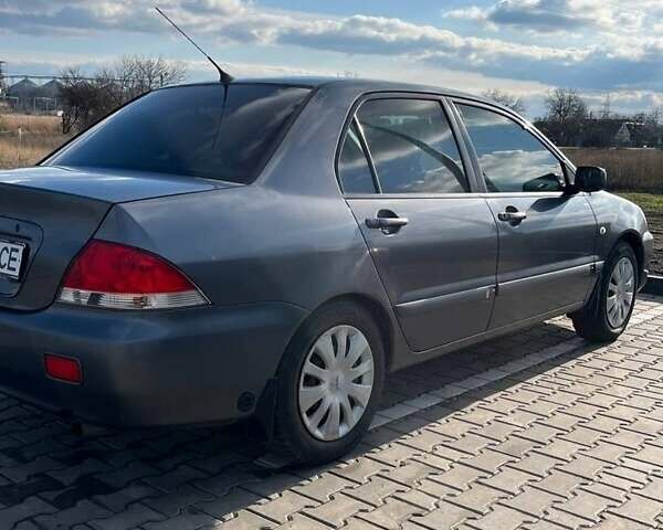 Серый Мицубиси Лансер, объемом двигателя 1.6 л и пробегом 255 тыс. км за 4500 $, фото 1 на Automoto.ua