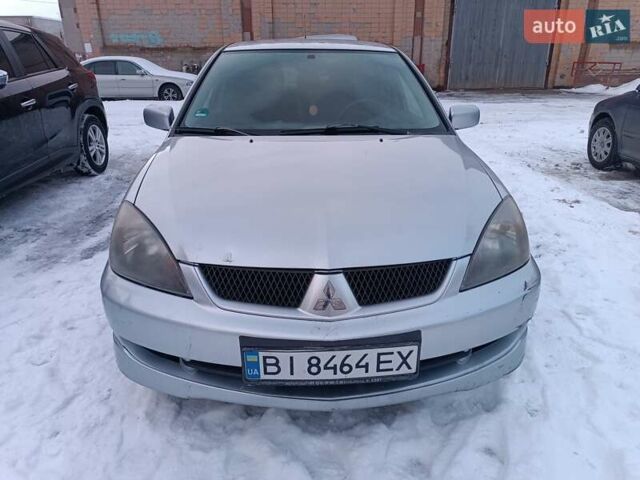 Серый Мицубиси Лансер, объемом двигателя 1.6 л и пробегом 160 тыс. км за 4700 $, фото 1 на Automoto.ua