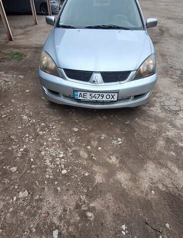 Серый Мицубиси Лансер, объемом двигателя 1.58 л и пробегом 223 тыс. км за 3200 $, фото 1 на Automoto.ua