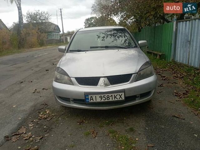 Серый Мицубиси Лансер, объемом двигателя 1.6 л и пробегом 350 тыс. км за 2700 $, фото 1 на Automoto.ua