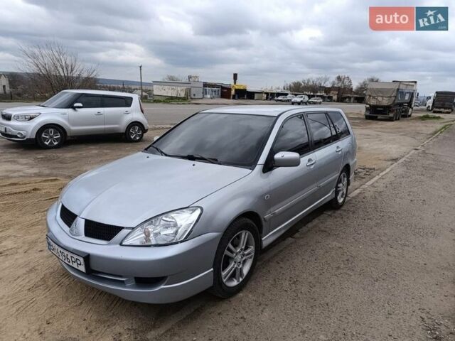 Серый Мицубиси Лансер, объемом двигателя 1.58 л и пробегом 274 тыс. км за 3600 $, фото 1 на Automoto.ua