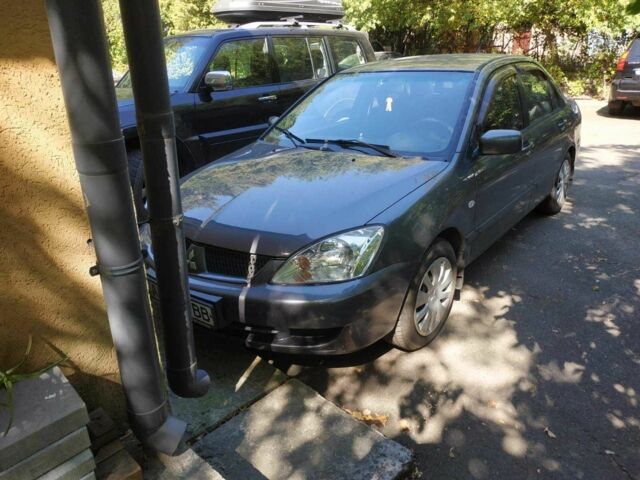 Серый Мицубиси Лансер, объемом двигателя 1.6 л и пробегом 178 тыс. км за 4000 $, фото 1 на Automoto.ua