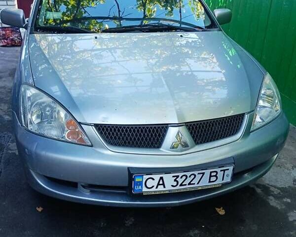 Сірий Міцубісі Lancer, об'ємом двигуна 1.6 л та пробігом 186 тис. км за 4200 $, фото 1 на Automoto.ua