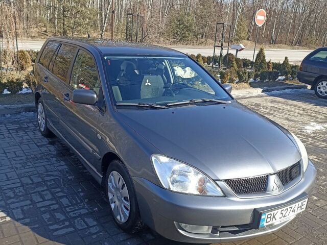 Сірий Міцубісі Lancer, об'ємом двигуна 1.58 л та пробігом 246 тис. км за 4100 $, фото 1 на Automoto.ua