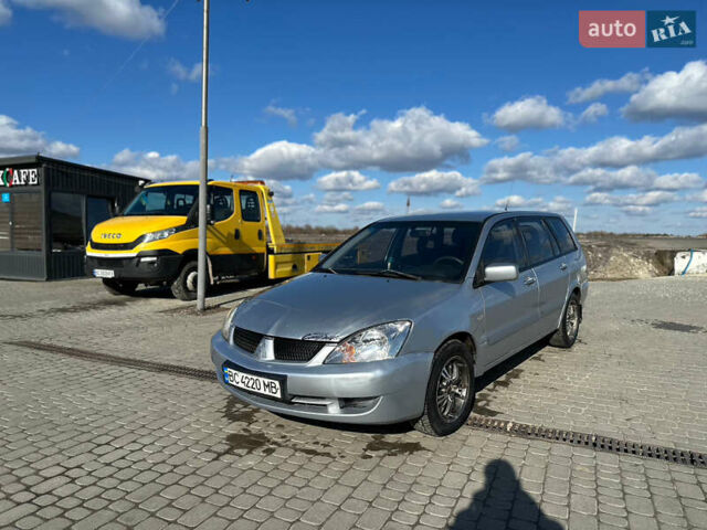 Серый Мицубиси Лансер, объемом двигателя 1.6 л и пробегом 505 тыс. км за 1999 $, фото 1 на Automoto.ua