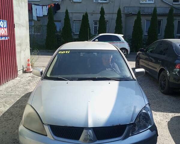 Сірий Міцубісі Lancer, об'ємом двигуна 1.58 л та пробігом 500 тис. км за 2100 $, фото 1 на Automoto.ua