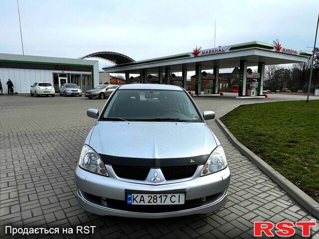 Серый Мицубиси Лансер, объемом двигателя 1.6 л и пробегом 260 тыс. км за 4200 $, фото 1 на Automoto.ua
