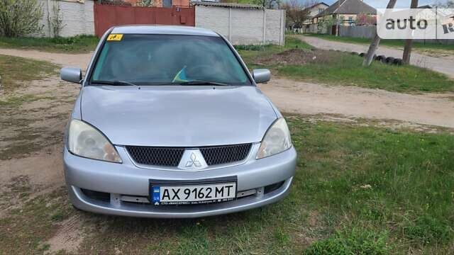 Серый Мицубиси Лансер, объемом двигателя 1.6 л и пробегом 185 тыс. км за 4700 $, фото 1 на Automoto.ua