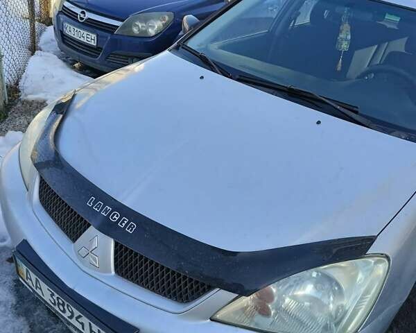 Серый Мицубиси Лансер, объемом двигателя 1.6 л и пробегом 198 тыс. км за 4100 $, фото 1 на Automoto.ua