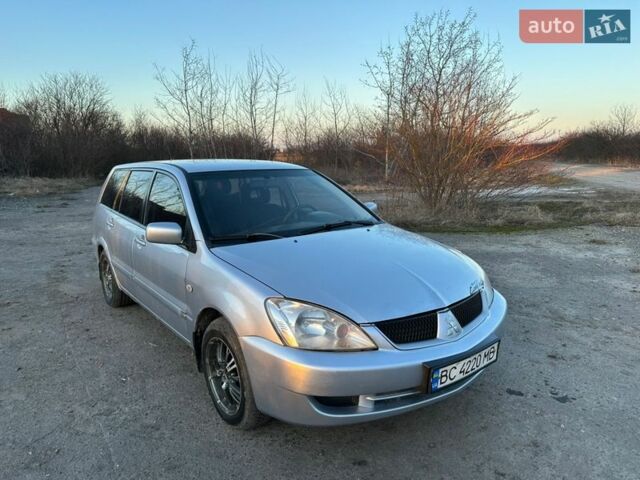 Серый Мицубиси Лансер, объемом двигателя 1.58 л и пробегом 330 тыс. км за 2499 $, фото 1 на Automoto.ua