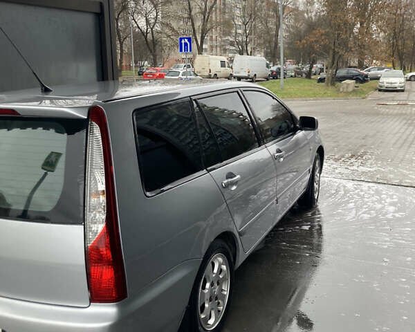 Сірий Міцубісі Lancer, об'ємом двигуна 1.58 л та пробігом 247 тис. км за 4350 $, фото 1 на Automoto.ua