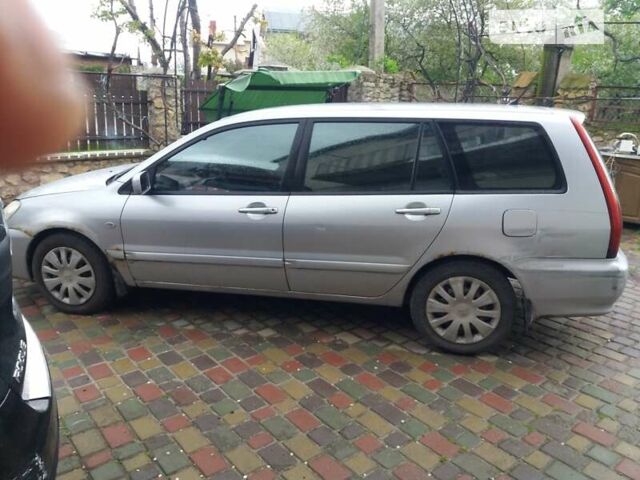 Серый Мицубиси Лансер, объемом двигателя 1.6 л и пробегом 220 тыс. км за 3699 $, фото 1 на Automoto.ua