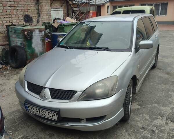 Серый Мицубиси Лансер, объемом двигателя 2 л и пробегом 242 тыс. км за 3500 $, фото 1 на Automoto.ua