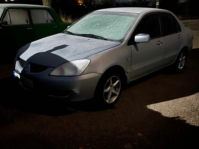 Серый Мицубиси Лансер, объемом двигателя 1.6 л и пробегом 340 тыс. км за 2900 $, фото 1 на Automoto.ua