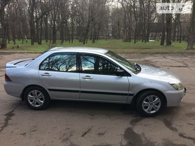 Сірий Міцубісі Lancer, об'ємом двигуна 1.6 л та пробігом 237 тис. км за 5500 $, фото 1 на Automoto.ua