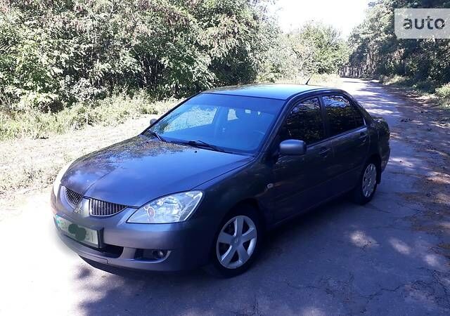 Сірий Міцубісі Lancer, об'ємом двигуна 1.6 л та пробігом 230 тис. км за 6000 $, фото 1 на Automoto.ua