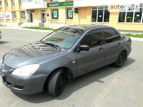 Сірий Міцубісі Lancer, об'ємом двигуна 1.6 л та пробігом 200 тис. км за 5500 $, фото 1 на Automoto.ua