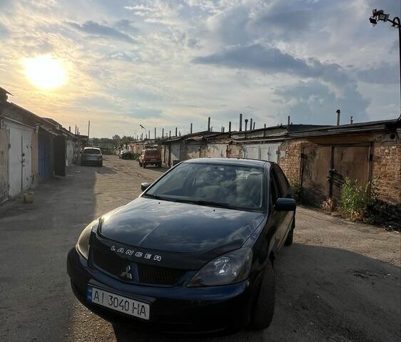 Синій Міцубісі Lancer, об'ємом двигуна 1.6 л та пробігом 180 тис. км за 4500 $, фото 1 на Automoto.ua