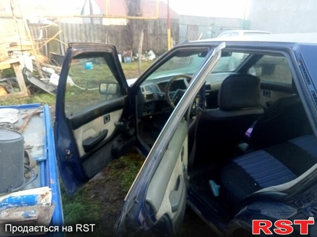 Синий Мицубиси Лансер, объемом двигателя 1.6 л и пробегом 300 тыс. км за 800 $, фото 1 на Automoto.ua