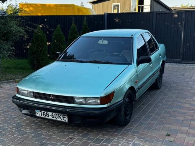 Синий Мицубиси Лансер, объемом двигателя 1.5 л и пробегом 300 тыс. км за 599 $, фото 1 на Automoto.ua