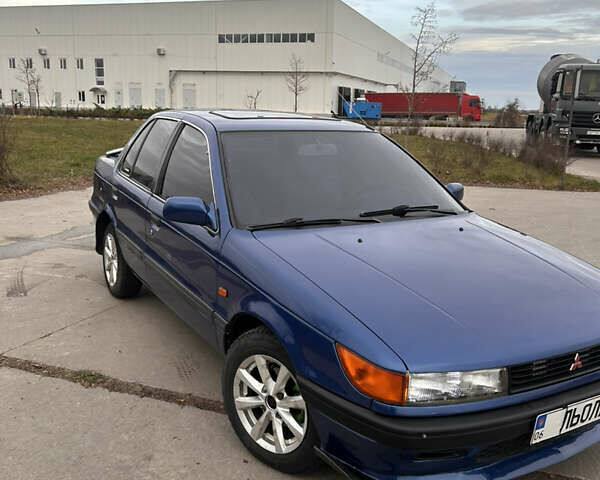 Синий Мицубиси Лансер, объемом двигателя 1.8 л и пробегом 245 тыс. км за 3000 $, фото 1 на Automoto.ua
