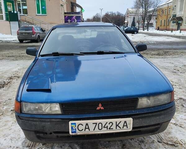 Синий Мицубиси Лансер, объемом двигателя 1.46 л и пробегом 360 тыс. км за 1200 $, фото 1 на Automoto.ua