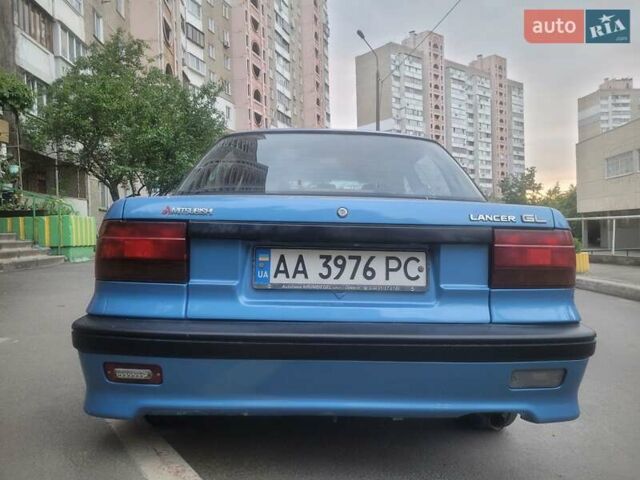 Синий Мицубиси Лансер, объемом двигателя 1.3 л и пробегом 280 тыс. км за 3000 $, фото 1 на Automoto.ua