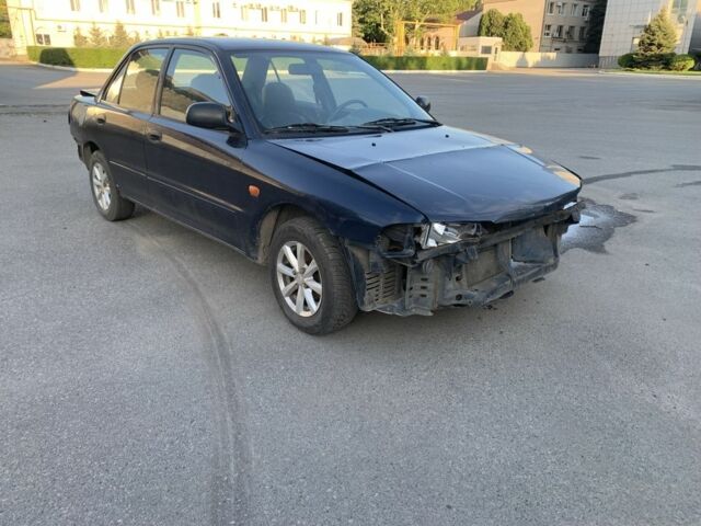 Синий Мицубиси Лансер, объемом двигателя 1.3 л и пробегом 250 тыс. км за 800 $, фото 1 на Automoto.ua