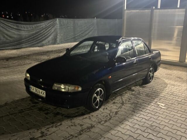 Синий Мицубиси Лансер, объемом двигателя 1.3 л и пробегом 300 тыс. км за 1700 $, фото 1 на Automoto.ua