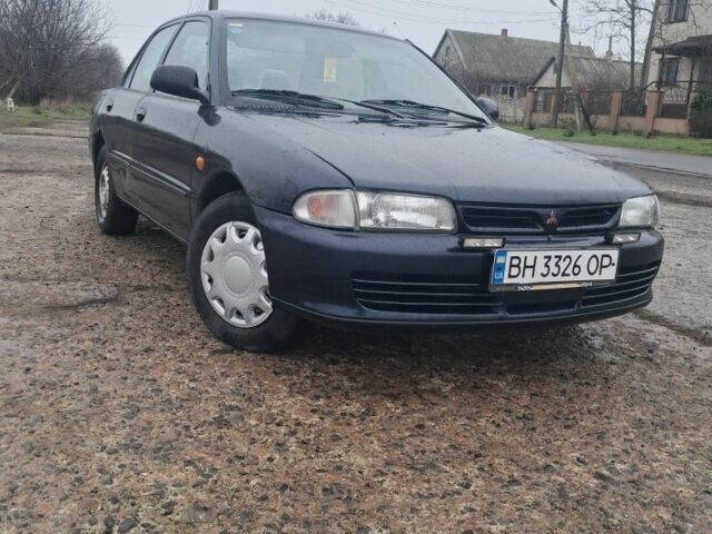 Синий Мицубиси Лансер, объемом двигателя 1.3 л и пробегом 300 тыс. км за 1000 $, фото 1 на Automoto.ua