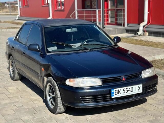 Синий Мицубиси Лансер, объемом двигателя 1.3 л и пробегом 379 тыс. км за 1600 $, фото 1 на Automoto.ua