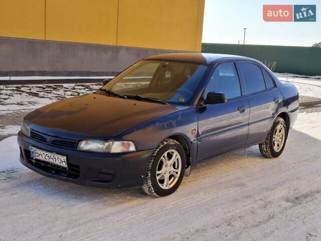 Синий Мицубиси Лансер, объемом двигателя 1.5 л и пробегом 402 тыс. км за 1550 $, фото 1 на Automoto.ua