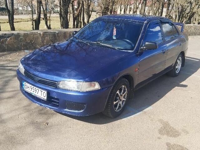 Синий Мицубиси Лансер, объемом двигателя 1.3 л и пробегом 2 тыс. км за 2204 $, фото 1 на Automoto.ua