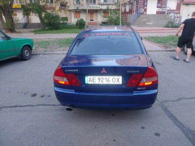 Синий Мицубиси Лансер, объемом двигателя 1.3 л и пробегом 270 тыс. км за 2100 $, фото 1 на Automoto.ua