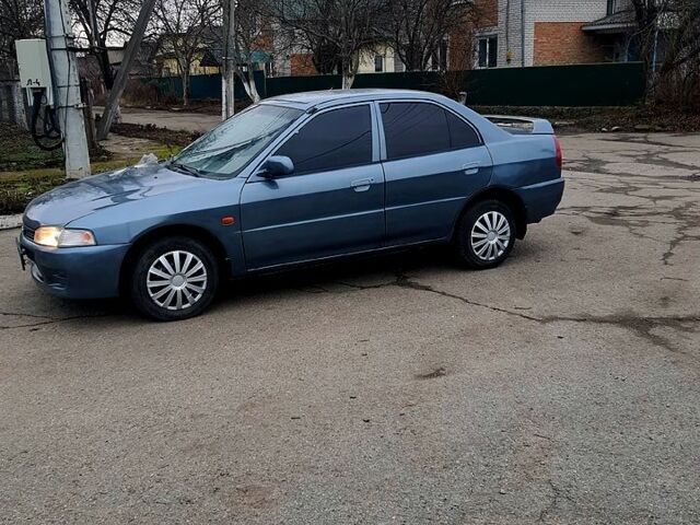 Синий Мицубиси Лансер, объемом двигателя 1.8 л и пробегом 180 тыс. км за 1700 $, фото 1 на Automoto.ua