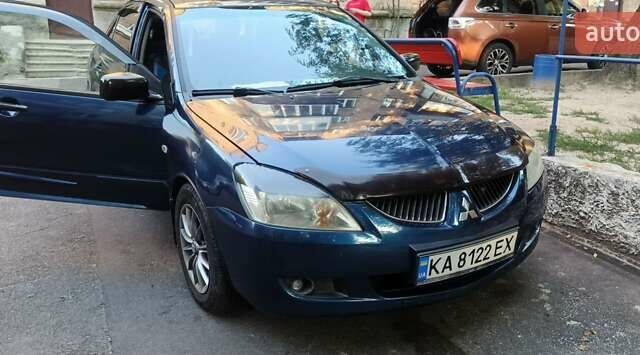 Синій Міцубісі Lancer, об'ємом двигуна 1.58 л та пробігом 411 тис. км за 2800 $, фото 1 на Automoto.ua