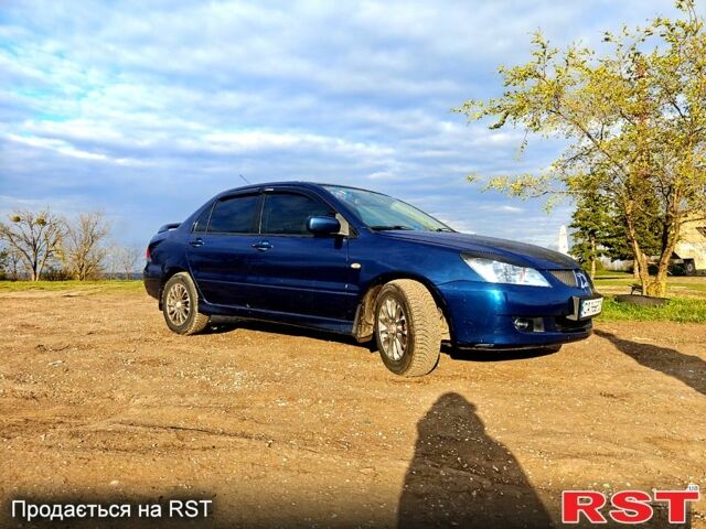 Синій Міцубісі Lancer, об'ємом двигуна 1.6 л та пробігом 190 тис. км за 4000 $, фото 1 на Automoto.ua