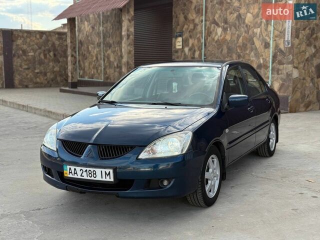 Синій Міцубісі Lancer, об'ємом двигуна 1.58 л та пробігом 299 тис. км за 3999 $, фото 1 на Automoto.ua