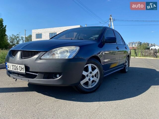 Синій Міцубісі Lancer, об'ємом двигуна 1.6 л та пробігом 240 тис. км за 1700 $, фото 1 на Automoto.ua